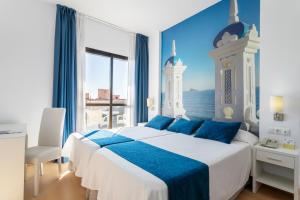 Postel nebo postele na pokoji v ubytování Hotel Avenida