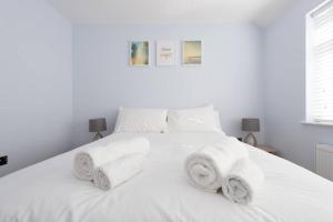 En eller flere senge i et værelse på Trendy 2 Bed - A hidden Luxury in Hayes nr Heathrow