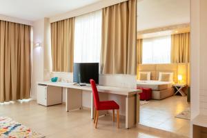 TV a/nebo společenská místnost v ubytování Horizont Hotel