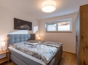 Posteľ alebo postele v izbe v ubytovaní Haus am Walde