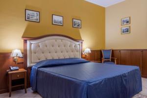 Posteľ alebo postele v izbe v ubytovaní Hotel San Michele