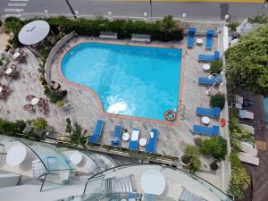 an overhead view of a swimming pool at a hotel at Hotel Ambassador in Rimini