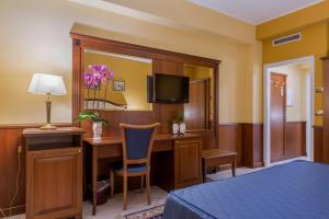 Posteľ alebo postele v izbe v ubytovaní Hotel San Michele