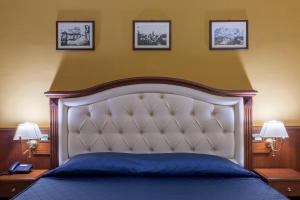 Posteľ alebo postele v izbe v ubytovaní Hotel San Michele