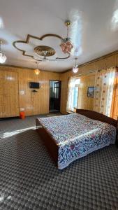 a bedroom with a large bed in a room at Dilaram Guest House in Srinagar