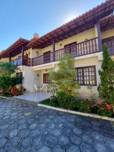 Casa con balcón y patio en Saquarema - Condomínio Residencial Iate hotel., en Saquarema