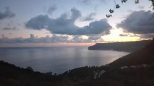 a sunset over a large body of water at Oroverde in Bergeggi