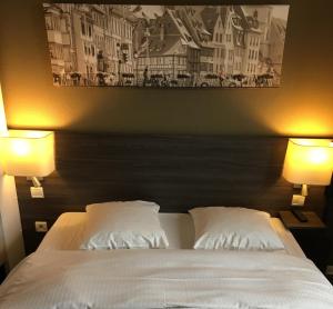 Postel nebo postele na pokoji v ubytování Als Hôtel