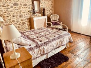 Postel nebo postele na pokoji v ubytování Gîte du Roc