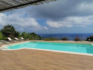 a swimming pool with a view of the ocean at Oroverde in Bergeggi