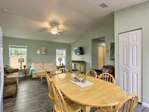 a living room with a table and a couch at Family-Friendly Home Near Steinhatchee River! in Steinhatchee