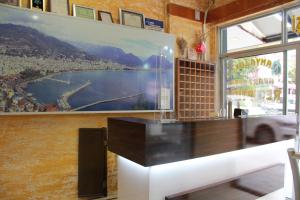 a large painting on the wall of a restaurant at Luxor apartments in Alanya