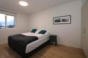 Postel nebo postele na pokoji v ubytování Nortia Apartments