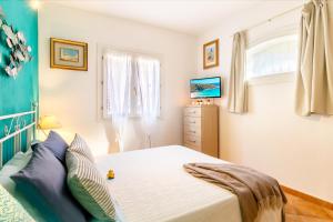 Postel nebo postele na pokoji v ubytování Residence Dei Fiori + 40 fotografií