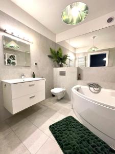 Kúpeľňa v ubytovaní LuxApart Kalisz Loft