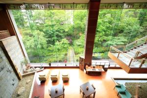 an image of a large room with a large window at Ryotei Hanayura in Noboribetsu +17 photos