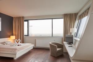 Telewizja i/lub zestaw kina domowego w obiekcie Rosenberger Seminar-Hotel Deutsch-Wagram