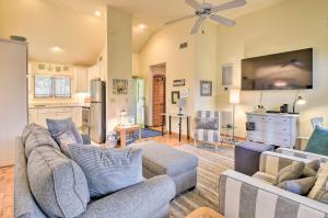 a living room with two couches and a kitchen at Southern Shores Family Retreat Mins to Beach! in Southern Shores