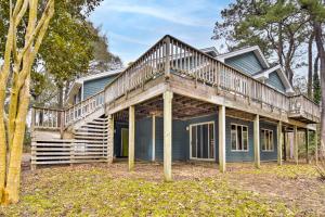 a house with a deck on top of it at Southern Shores Family Retreat Mins to Beach! in Southern Shores