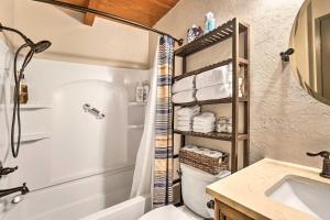 a bathroom with a shower and a toilet and a sink at Dog-Friendly Kings Beach Log Cabin with Hot Tub! in Kings Beach +35 photos