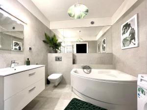 Kúpeľňa v ubytovaní LuxApart Kalisz Loft + 18 fotografií