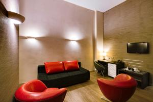 TV a/nebo společenská místnost v ubytování Artim Hotel