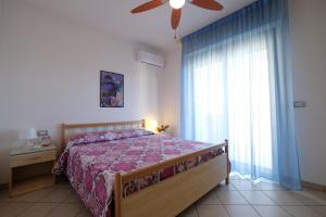 En eller flere senger på et rom på Green Bay A7 - Pineto Vacanza