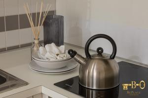 a tea kettle sitting on top of a kitchen counter at BePlace Apartments in Porta Romana in Milan