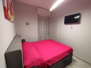 Posteľ alebo postele v izbe v ubytovaní Casa Vacanze Zia Rose