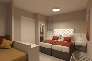 Ein Bett oder Betten in einem Zimmer der Unterkunft Likio Studios