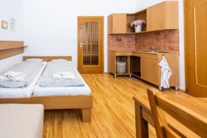 Posteľ alebo postele v izbe v ubytovaní Apartmány Podyjí