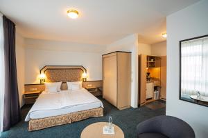 Ein Bett oder Betten in einem Zimmer der Unterkunft Apart' Hotel