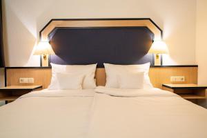 Ein Bett oder Betten in einem Zimmer der Unterkunft Apart' Hotel