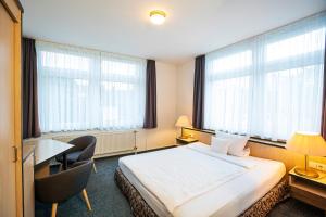 Ein Bett oder Betten in einem Zimmer der Unterkunft Apart' Hotel