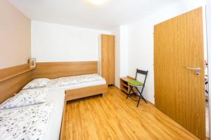 Posteľ alebo postele v izbe v ubytovaní Apartmány Podyjí