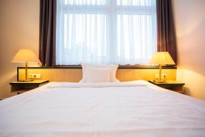 Ein Bett oder Betten in einem Zimmer der Unterkunft Apart' Hotel
