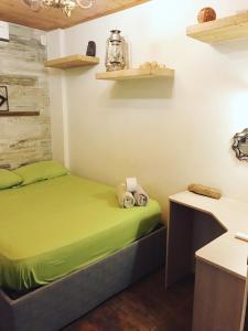 a room with a bed and shelves on the wall at Casa Mamá Waldy New in Cartagena de Indias