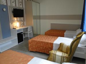 Postel nebo postele na pokoji v ubytování Hotel Moderno