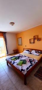 A bed or beds in a room at Apartmani Natalija i Zala