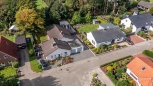 an overhead view of a house in a suburb at Family Ferienhaus Ennens in Rhauderfehn