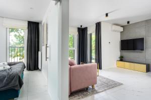 Televízia a/alebo spoločenská miestnosť v ubytovaní EL Apartments - Castor