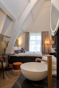 Ένα ή περισσότερα κρεβάτια σε δωμάτιο στο Boutique Hotel Jersey