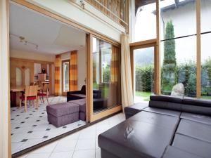 a living room with a couch and a table at Lovely Chalet in Mayrhofen with Private Garden in Mayrhofen