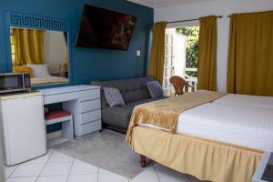 Ein Bett oder Betten in einem Zimmer der Unterkunft E 20 Mystic Ridge ocho Rios