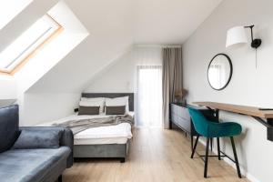 מיטה או מיטות בחדר ב-Komfortowe OH Apartamenty Zator