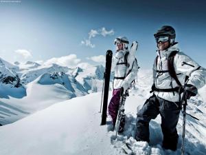two people standing on top of a snow covered mountain at Apartment in Kaprun with Ski-in Ski-out Access in Kaprun