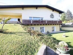 a house with a large yard in front of it at Apartment in Feldkirchen near Ossiacher See in Feldkirchen in Kärnten