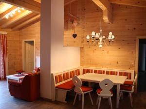 a dining room with a table and chairs at Comfortable Cottage near Ski Area in Leogang in Leogang