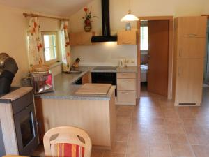 a kitchen with a counter and a stove top oven at Spacious Chalet near Ski Area in Turracherhohe in Turracher Hohe
