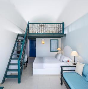a living room with a loft bed and a couch at Veggera Beach Hotel in Perissa